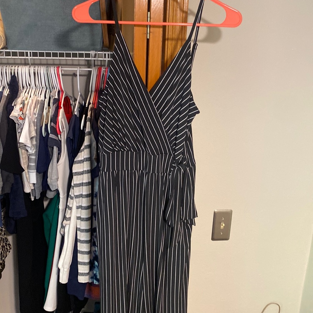 Size medium black and white striped jump suit